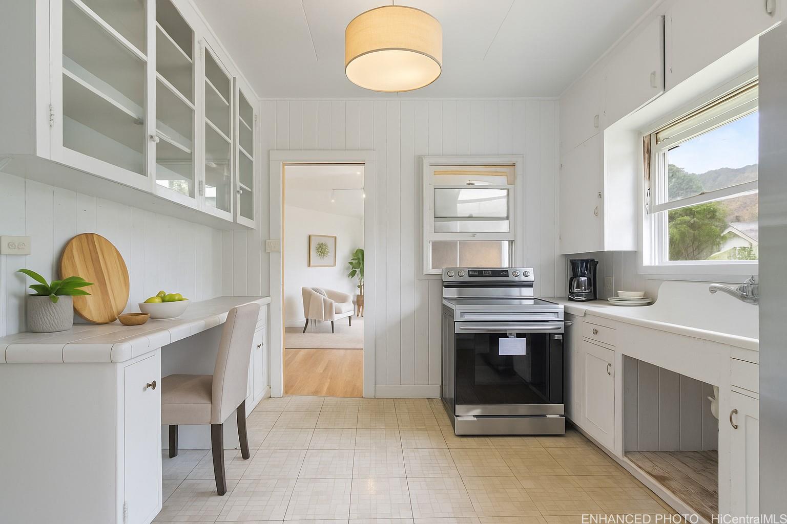 54-230 Hauula Homestead Road, Unit A Hauula, HI 96717 - Photo 3 of 22 a kitchen with a sink cabinets and window