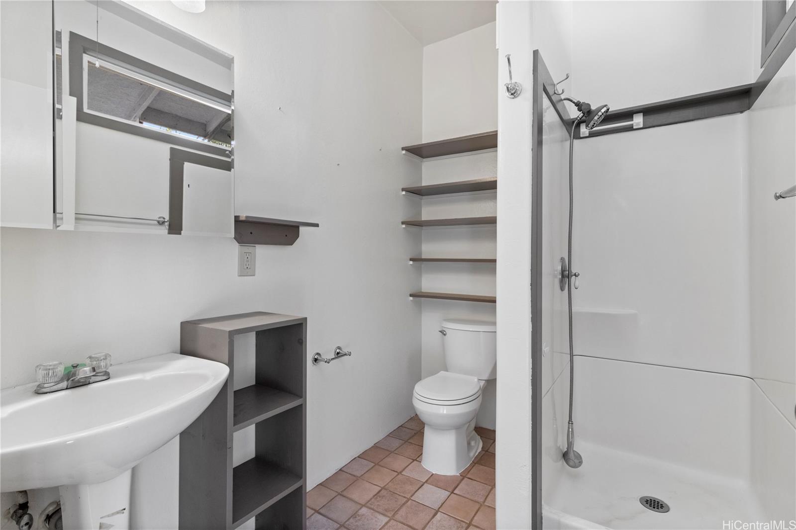 54-230 Hauula Homestead Road, Unit A Hauula, HI 96717 - Photo 7 of 22 a bathroom with a sink toilet and shower