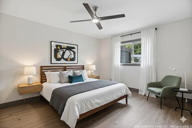 a bedroom with bed and a window