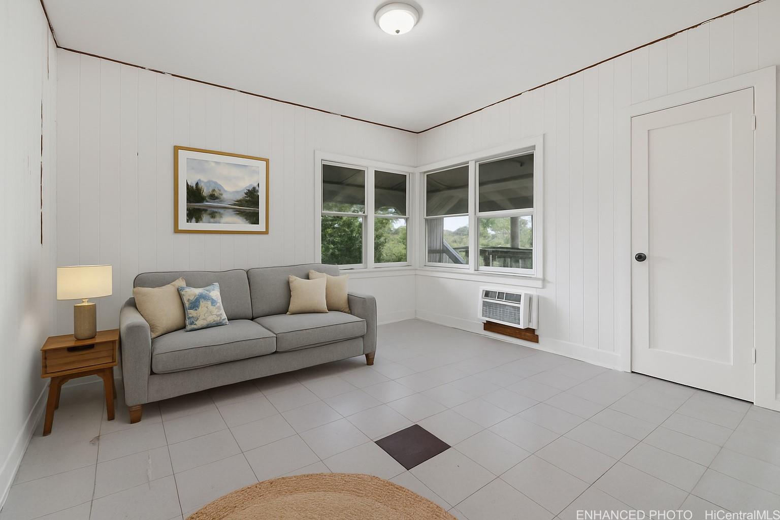 54-230 Hauula Homestead Road, Unit A Hauula, HI 96717 - Photo 9 of 22 a living room with furniture and a large window