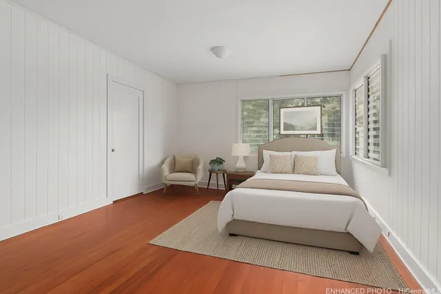 a bedroom with a bed and a couch