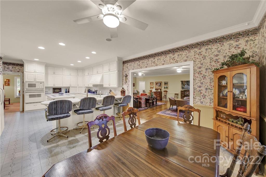 2319 Hough Road Lancaster, SC 29720 - Photo 12 of 48 a living room with lots of chairs and kitchen view
