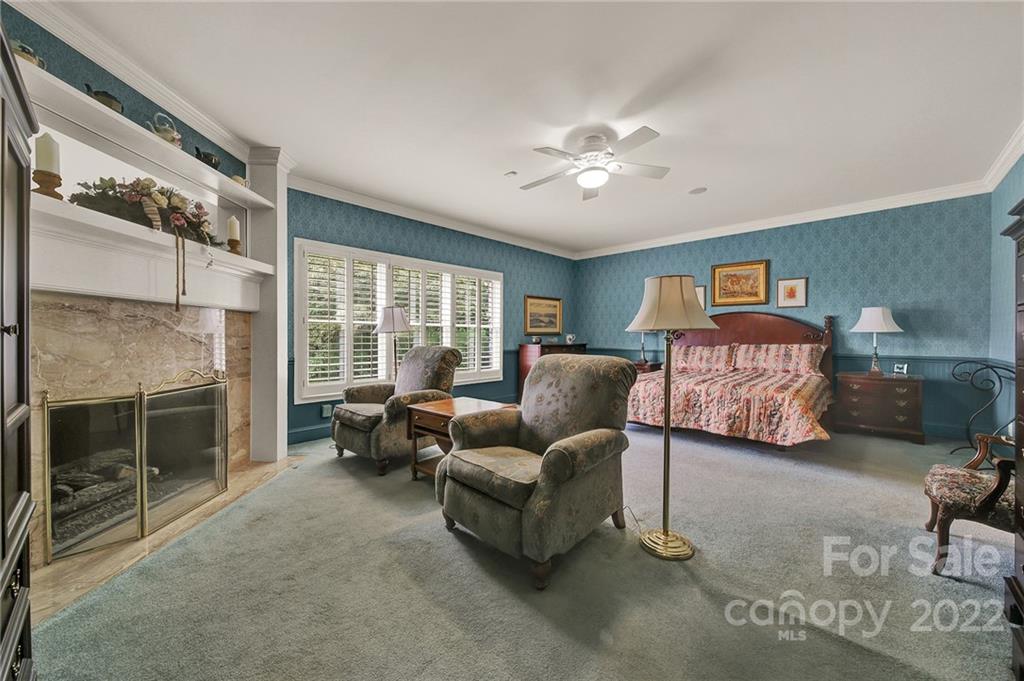 2319 Hough Road Lancaster, SC 29720 - Photo 14 of 48 a bedroom with furniture and a fireplace