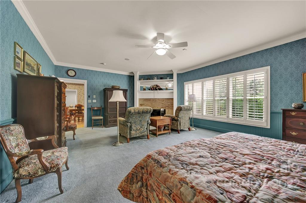 2319 Hough Road Lancaster, SC 29720 - Photo 17 of 48 a bed room with a bed and a chair