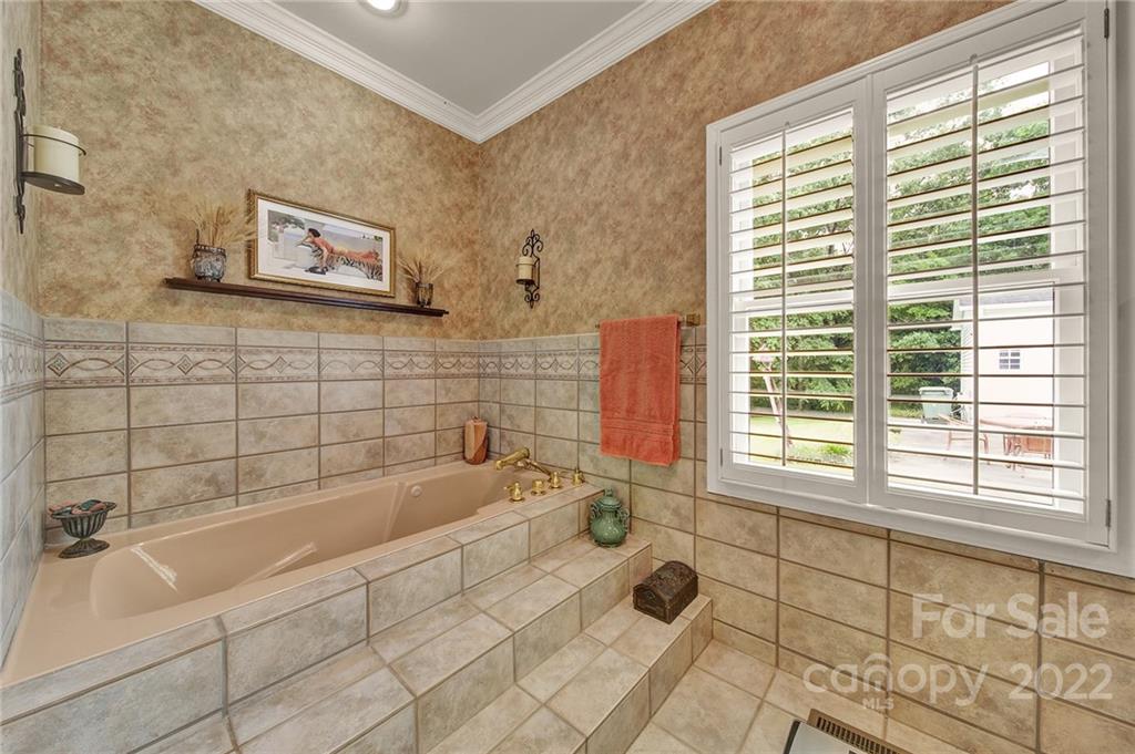 2319 Hough Road Lancaster, SC 29720 - Photo 19 of 48 a bathroom with a bathtub and next to a window