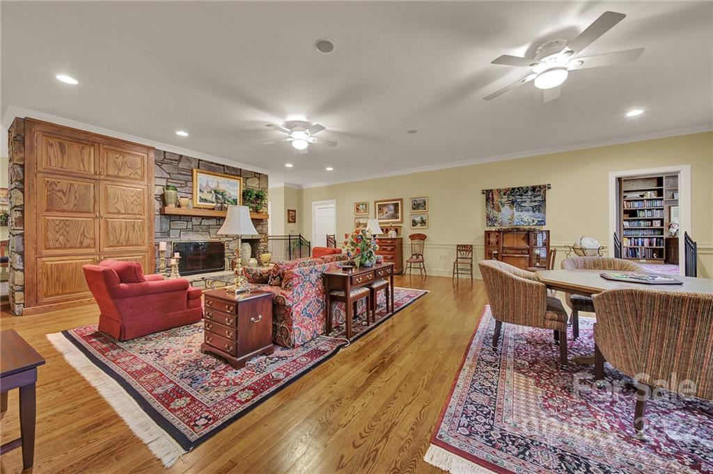 2319 Hough Road Lancaster, SC 29720 - Photo 24 of 48 a living room with furniture a rug and a chandelier