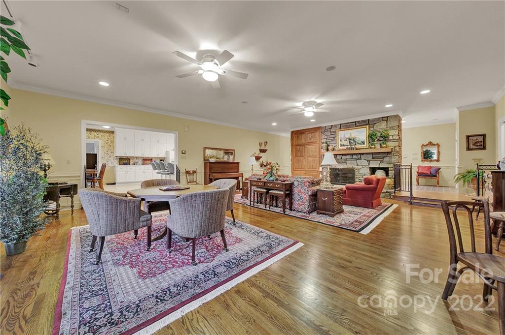 2319 Hough Road Lancaster, SC 29720 - Photo 26 of 48 a living room with furniture and a dining table with wooden floor