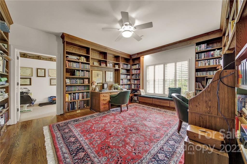 2319 Hough Road Lancaster, SC 29720 - Photo 29 of 48 a living room with a large bookshelf and a book shelf