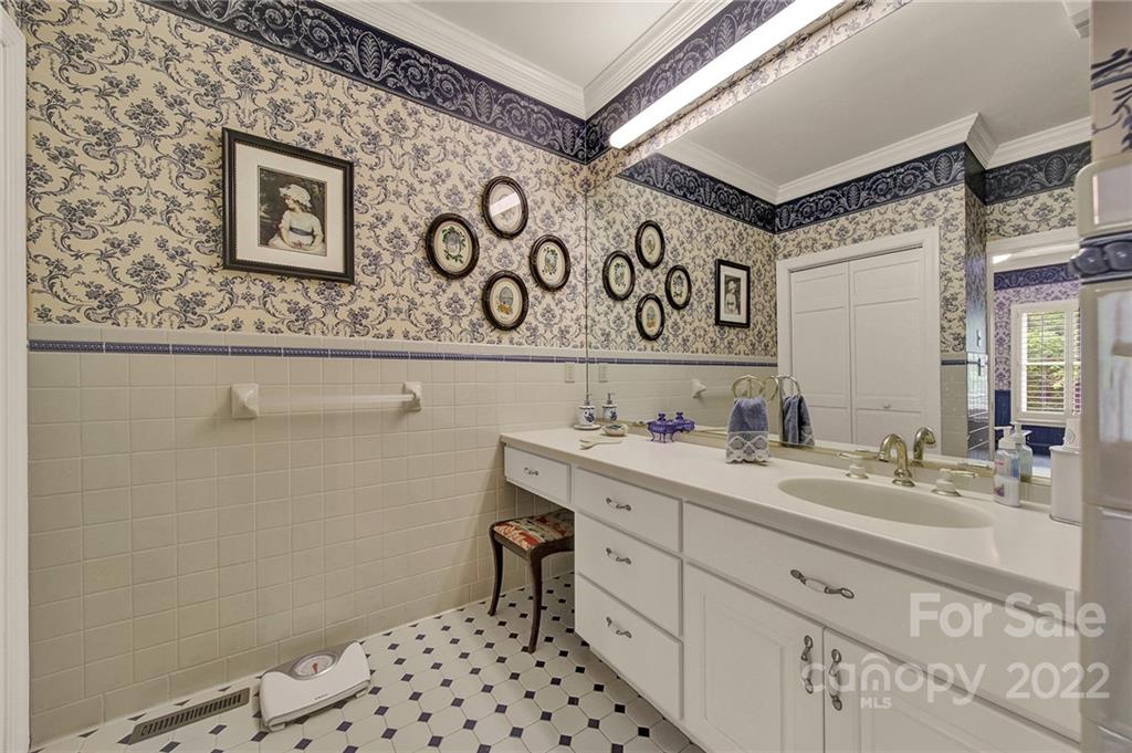 2319 Hough Road Lancaster, SC 29720 - Photo 38 of 48 a bathroom with a sink a mirror and a toilet