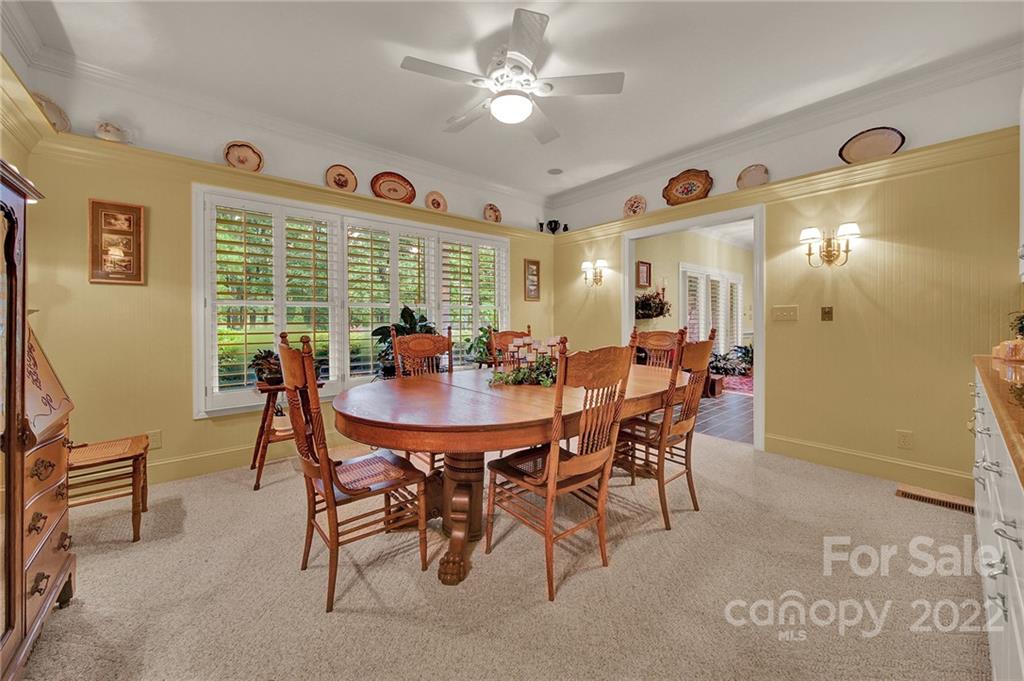 2319 Hough Road Lancaster, SC 29720 - Photo 5 of 48 a view of a dining room with furniture and a chandelier