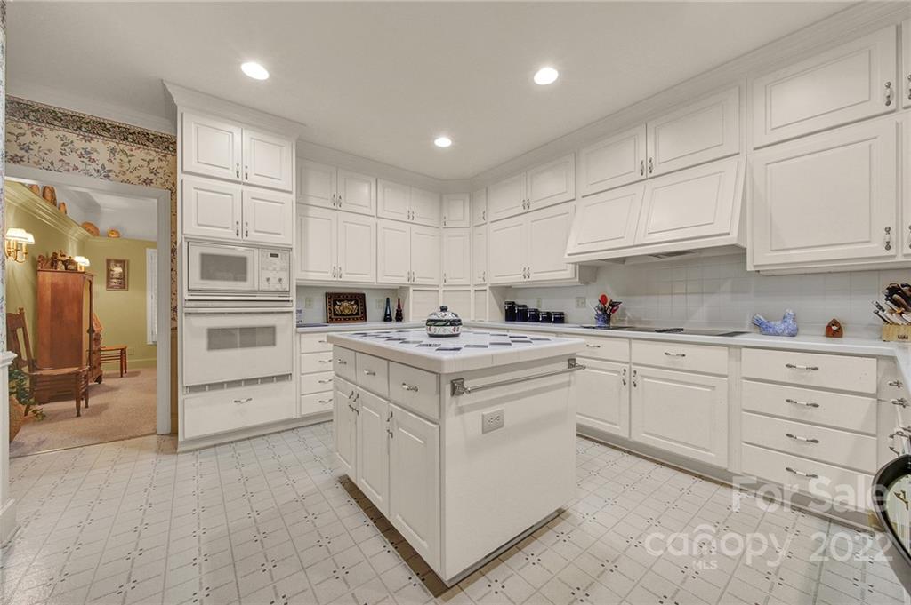 2319 Hough Road Lancaster, SC 29720 - Photo 10 of 48 a kitchen with granite countertop white cabinets and white appliances
