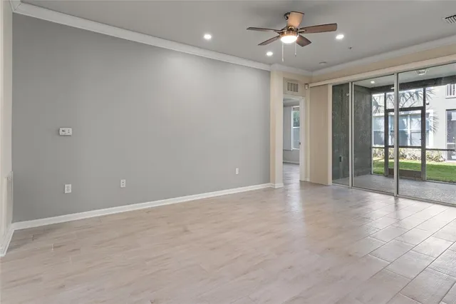 a view of an empty room with glass door