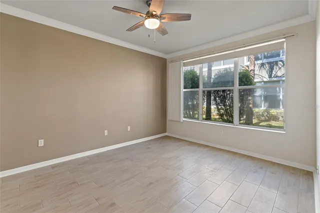 a view of an empty room with a window
