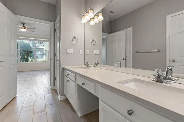 a bathroom with a sink double vanity and a mirror