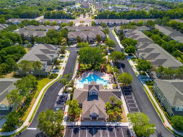 an aerial view of residential houses with outdoor space