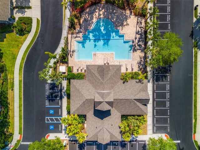 an aerial view of a house with a yard and garden