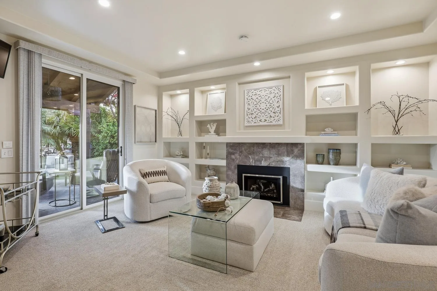 a living room with furniture and a fireplace