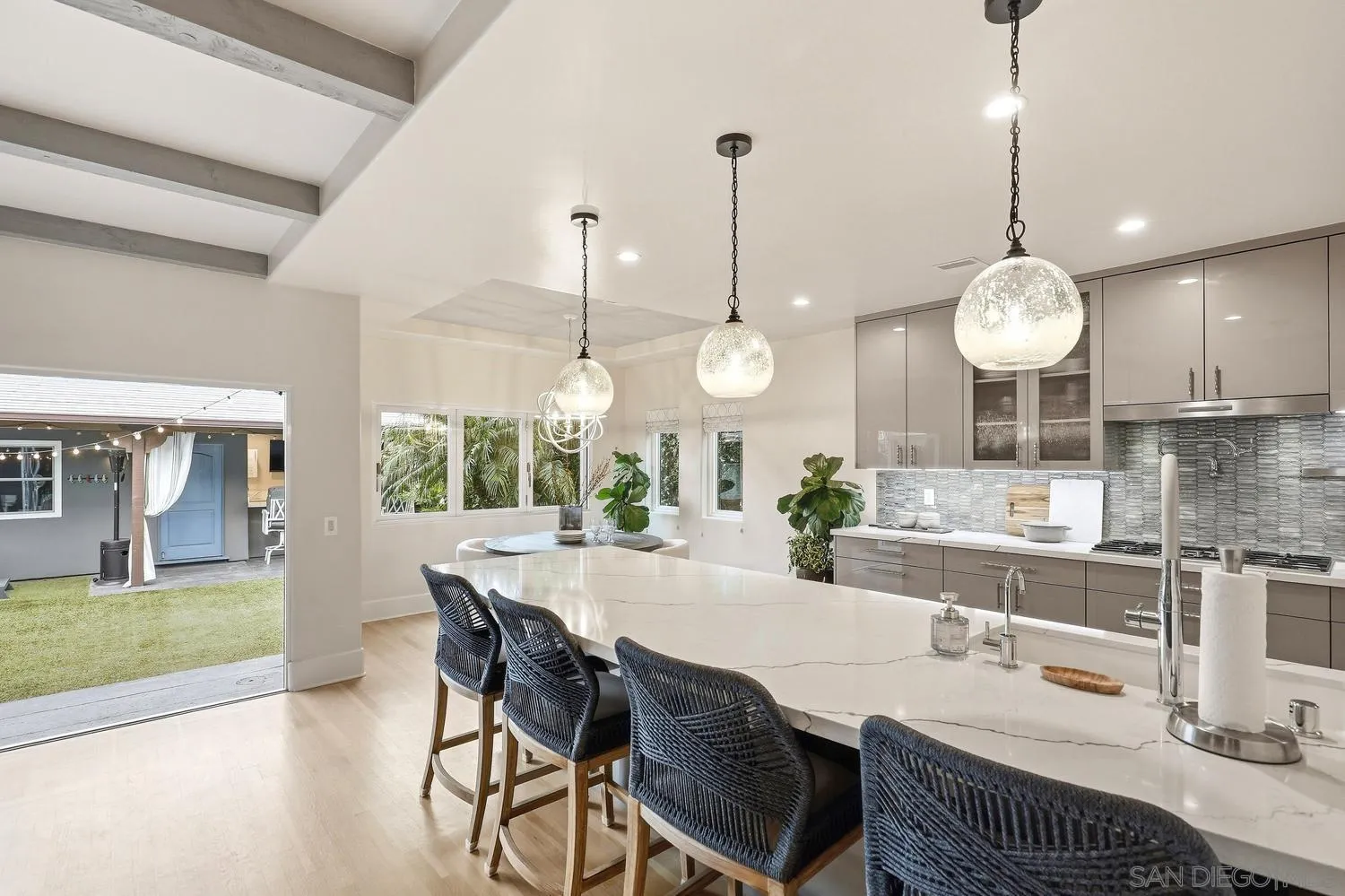 531 J Avenue Coronado, CA 92118 - Photo 17 of 58 a large kitchen with a table and chairs