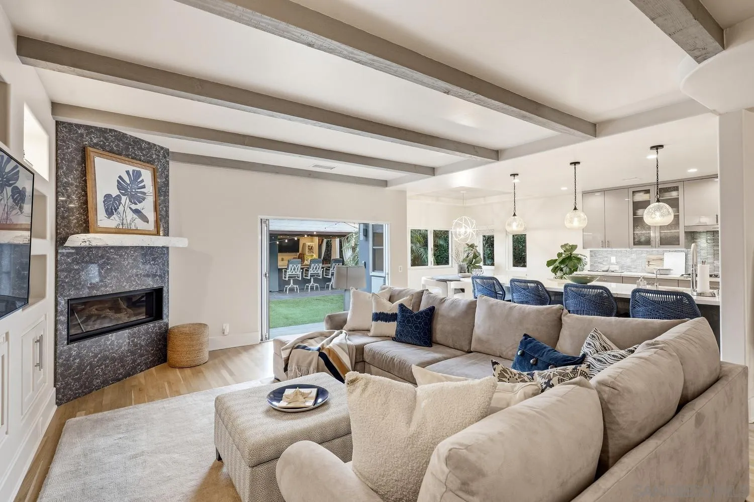 531 J Avenue Coronado, CA 92118 - Photo 21 of 58 a living room with furniture a fireplace and a large window