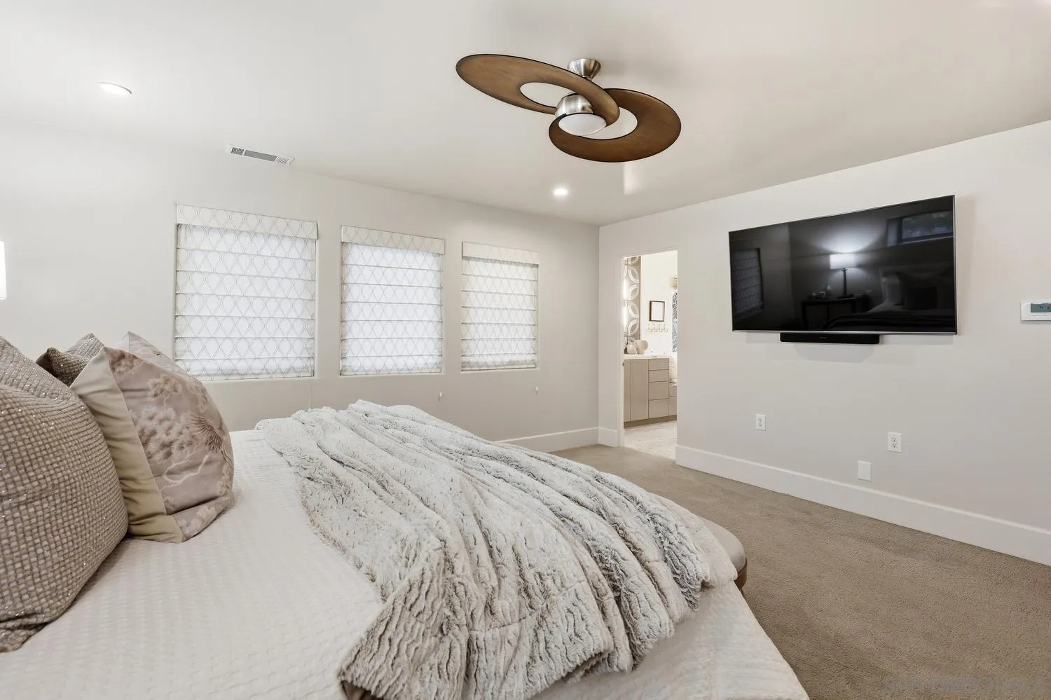 531 J Avenue Coronado, CA 92118 - Photo 25 of 58 a bedroom with a large bed and a flat screen tv
