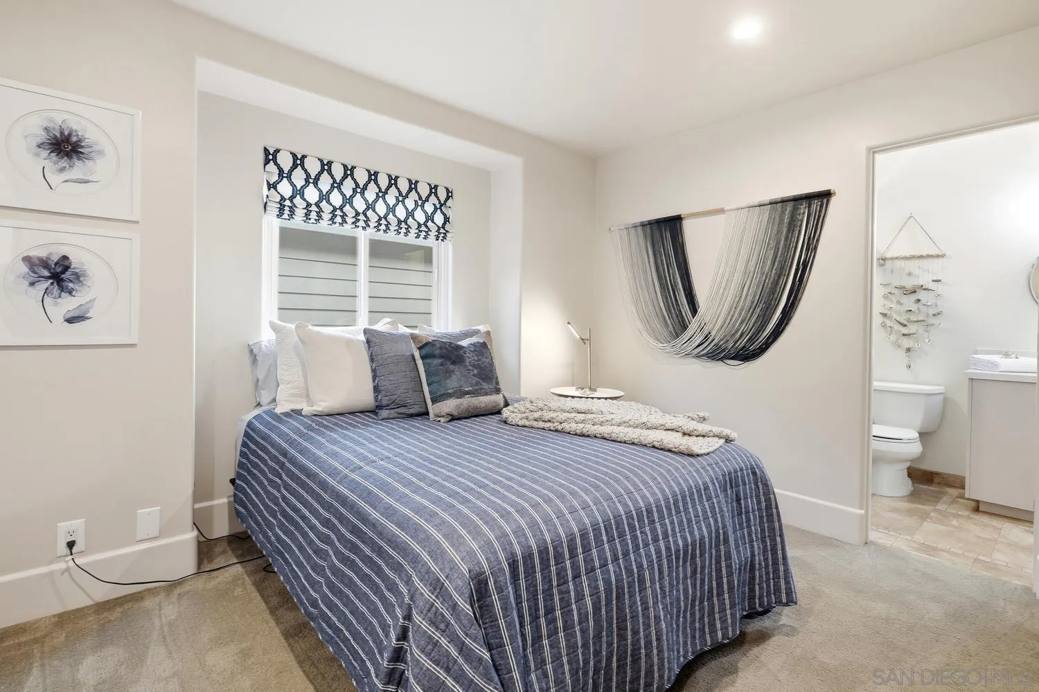 531 J Avenue Coronado, CA 92118 - Photo 30 of 58 a bedroom with a bed and a mirror