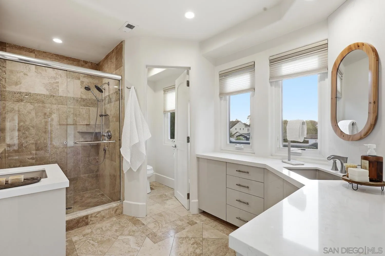 531 J Avenue Coronado, CA 92118 - Photo 34 of 58 a spacious bathroom with a sink a toilet and a shower