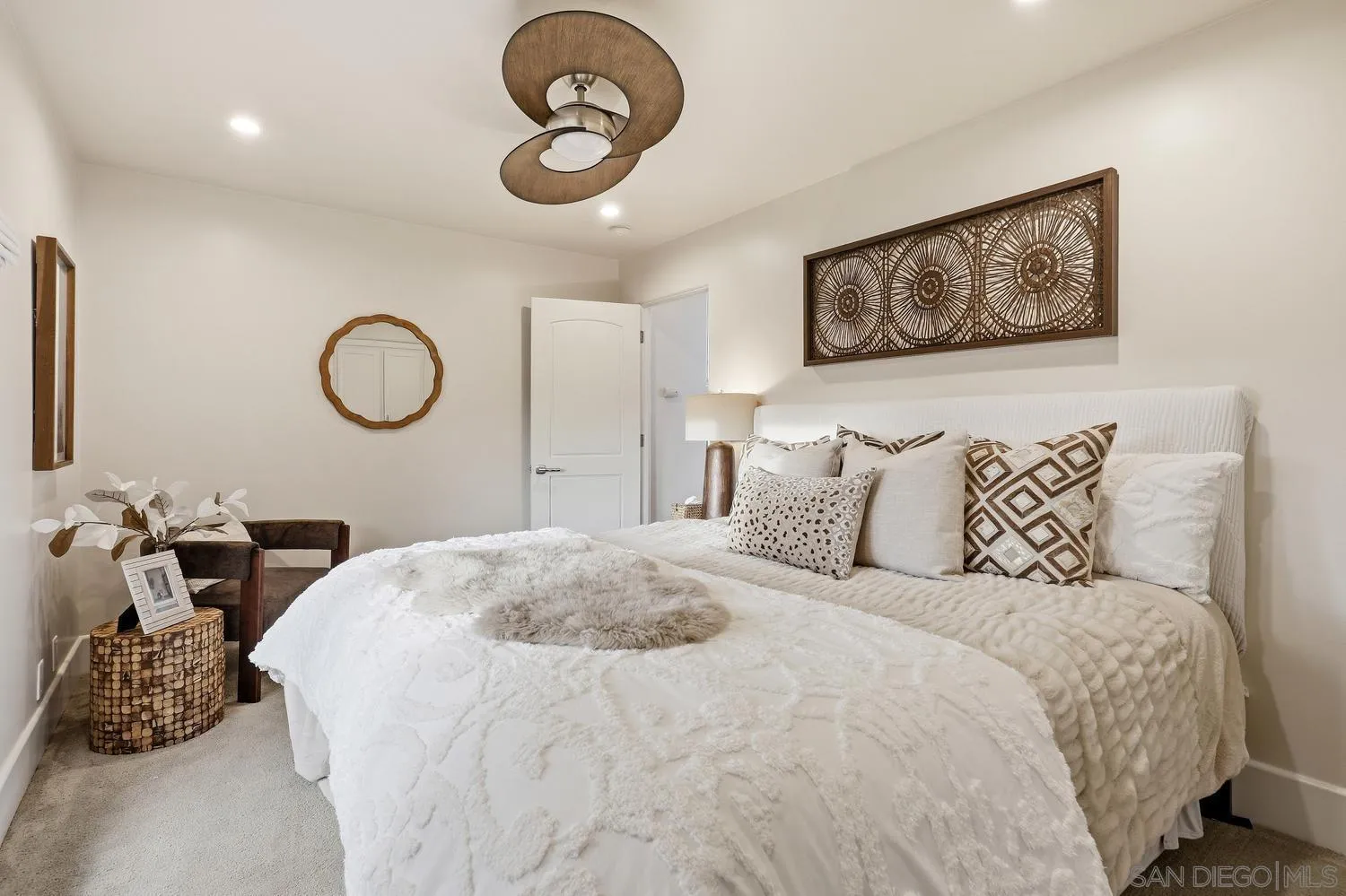 531 J Avenue Coronado, CA 92118 - Photo 35 of 58 a bedroom with a bed and a chandelier