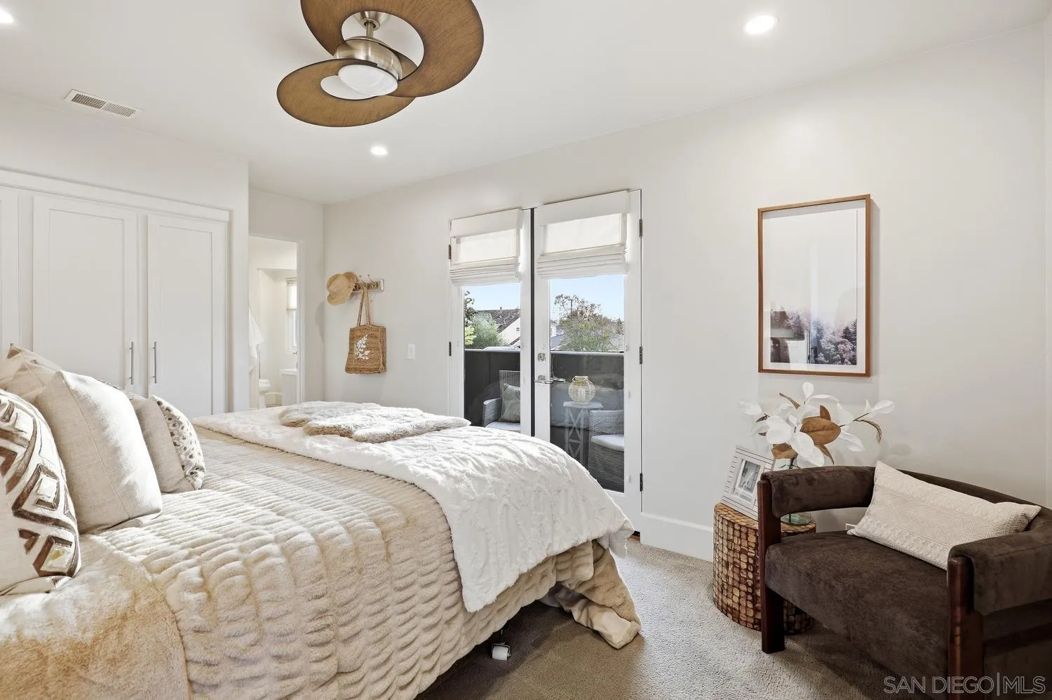 531 J Avenue Coronado, CA 92118 - Photo 36 of 58 a bedroom with a bed and painting on the wall