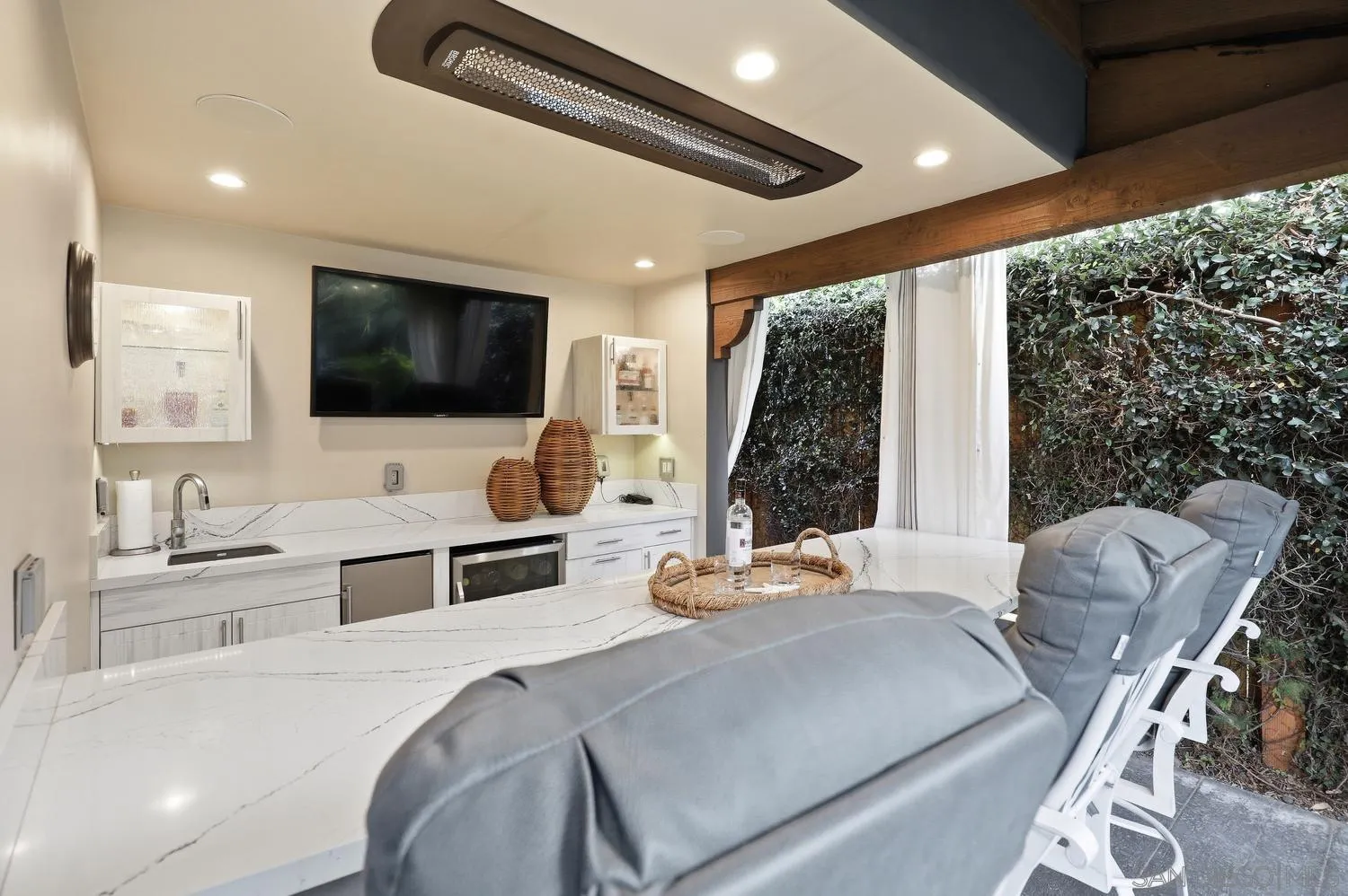531 J Avenue Coronado, CA 92118 - Photo 43 of 58 a bedroom with a bed and a flat screen tv