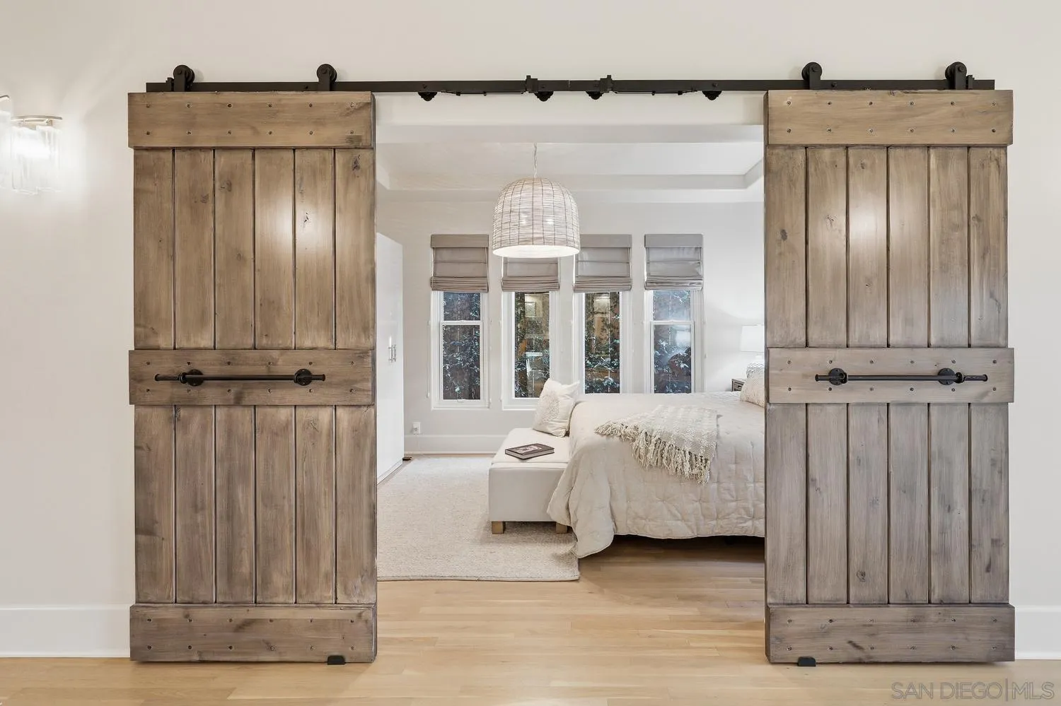 531 J Avenue Coronado, CA 92118 - Photo 5 of 58 a bed room with a bed and a large mirror