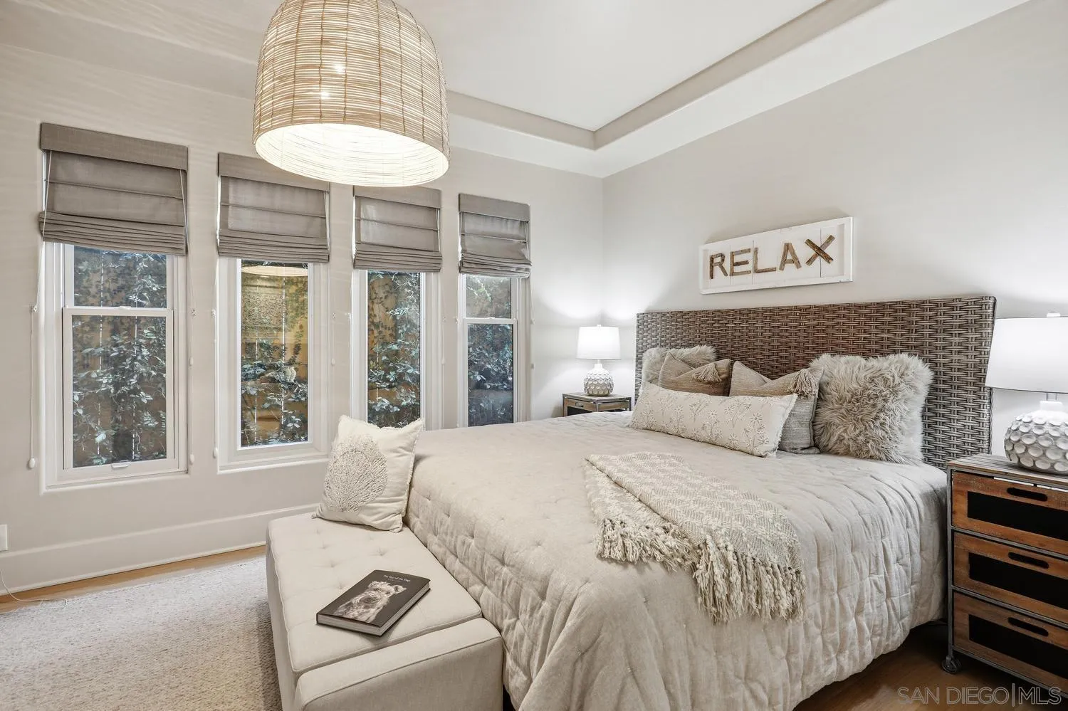 531 J Avenue Coronado, CA 92118 - Photo 6 of 58 a bedroom with a large bed and a chandelier
