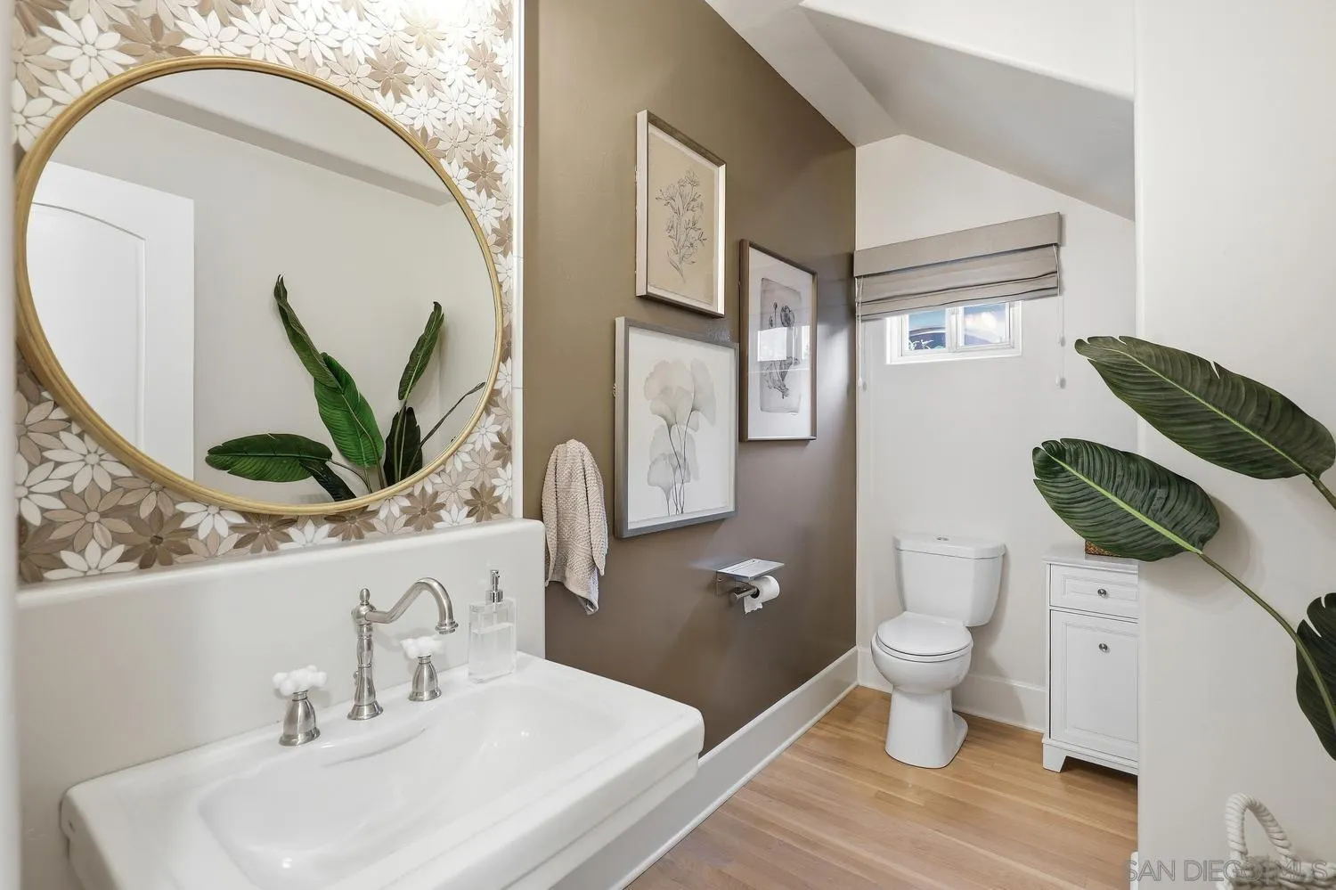 531 J Avenue Coronado, CA 92118 - Photo 8 of 58 a bathroom with a toilet sink and mirror