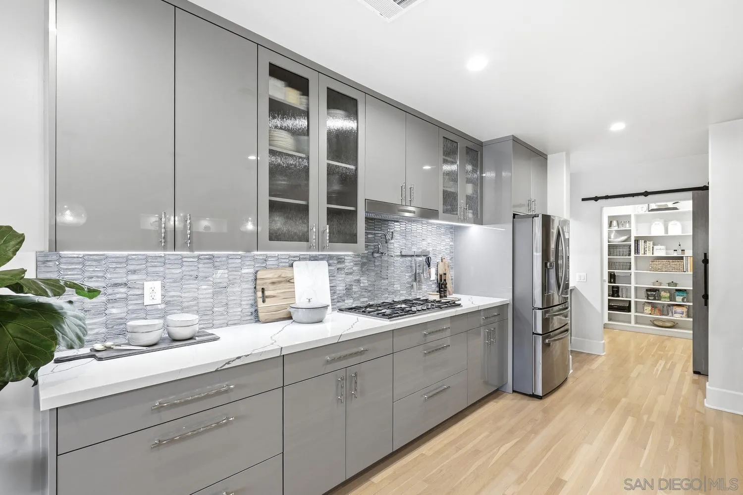 531 J Avenue Coronado, CA 92118 - Photo 10 of 58 a kitchen with a sink stainless steel appliances and cabinets