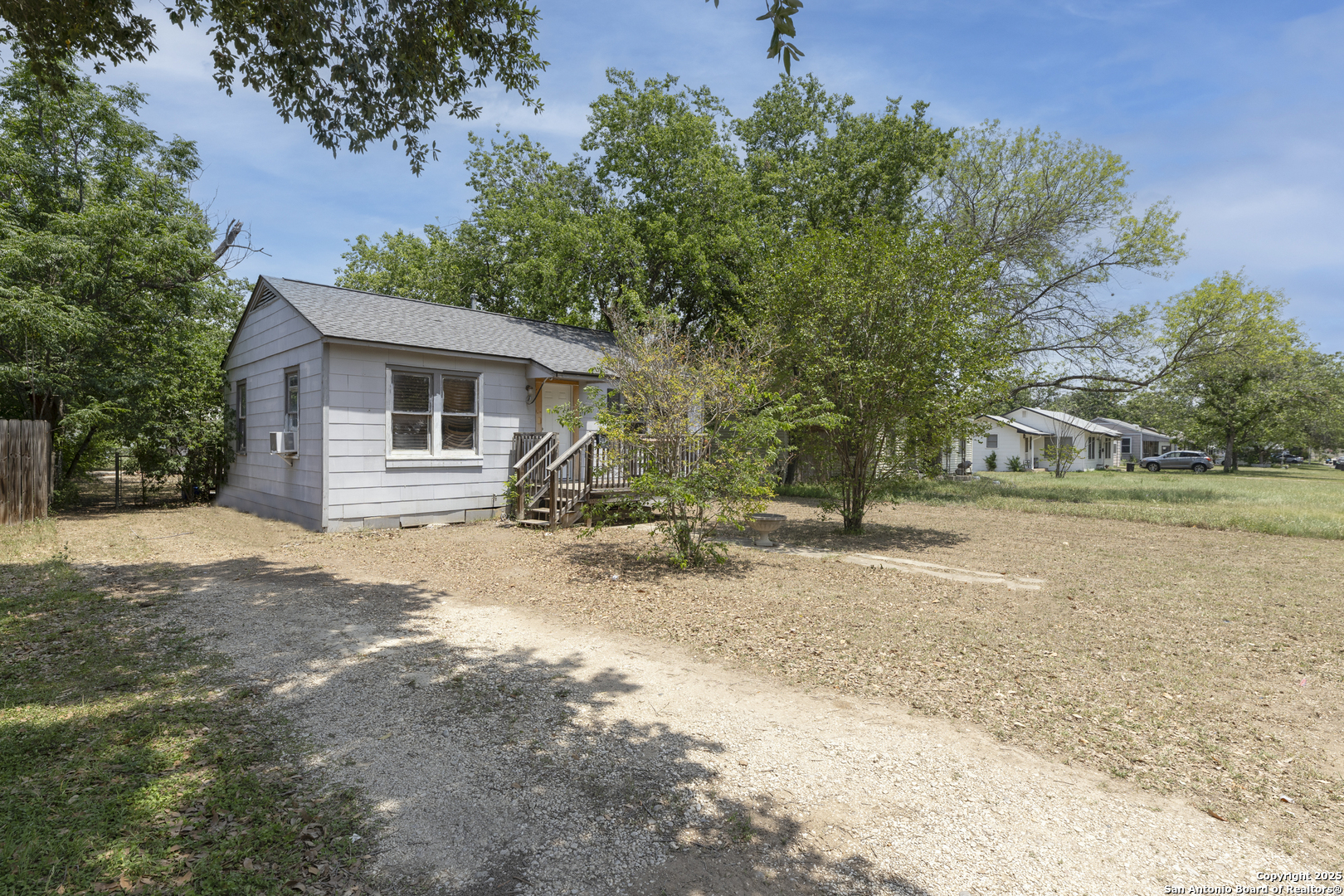 511 Wright Avenue Schertz, TX 78154 - Photo 1 of 1 a view of a house with backyard and trees