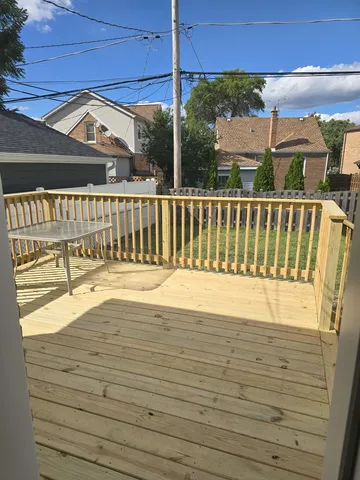a view of balcony with wooden floor