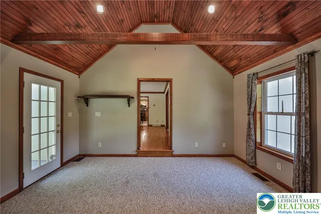 a bedroom with a bed dresser and a window