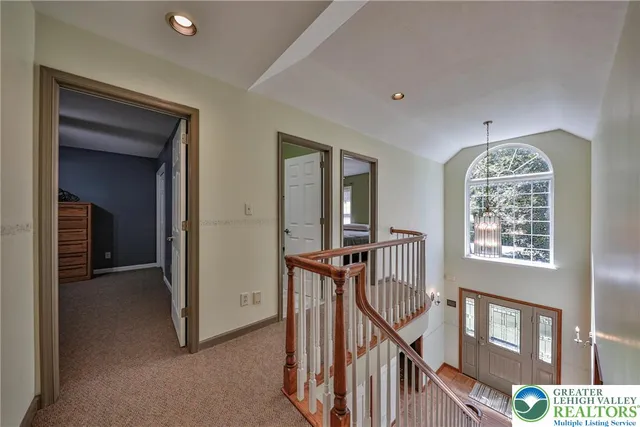 a bathroom with a granite countertop sink a toilet and a mirror