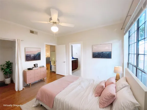 a bedroom with two beds and a large mirror