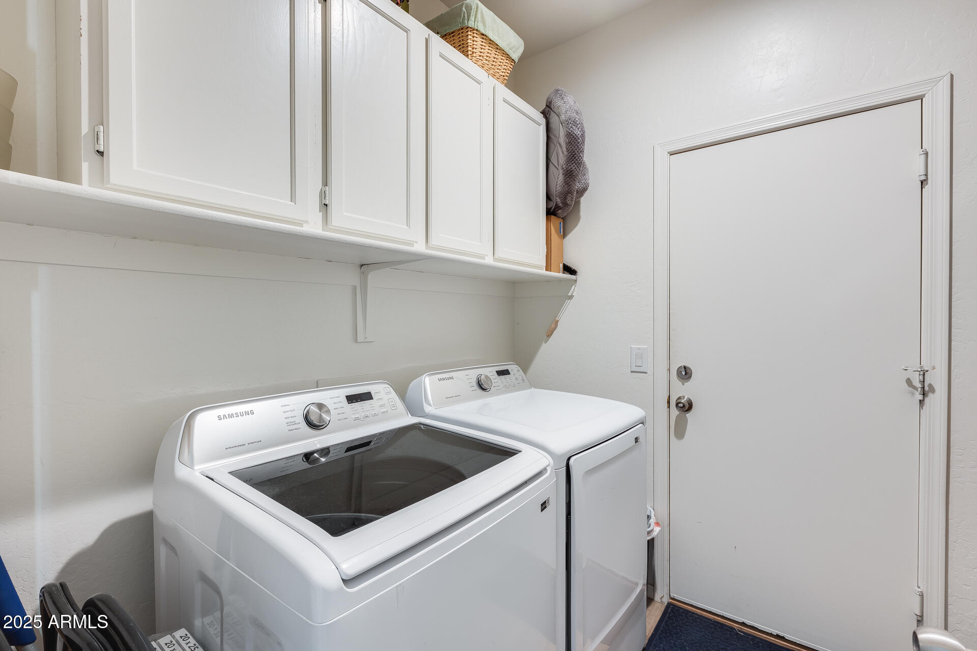 14229 West Calavar Road Surprise, AZ 85379 - Photo 22 of 44 a utility room with dryer and washer
