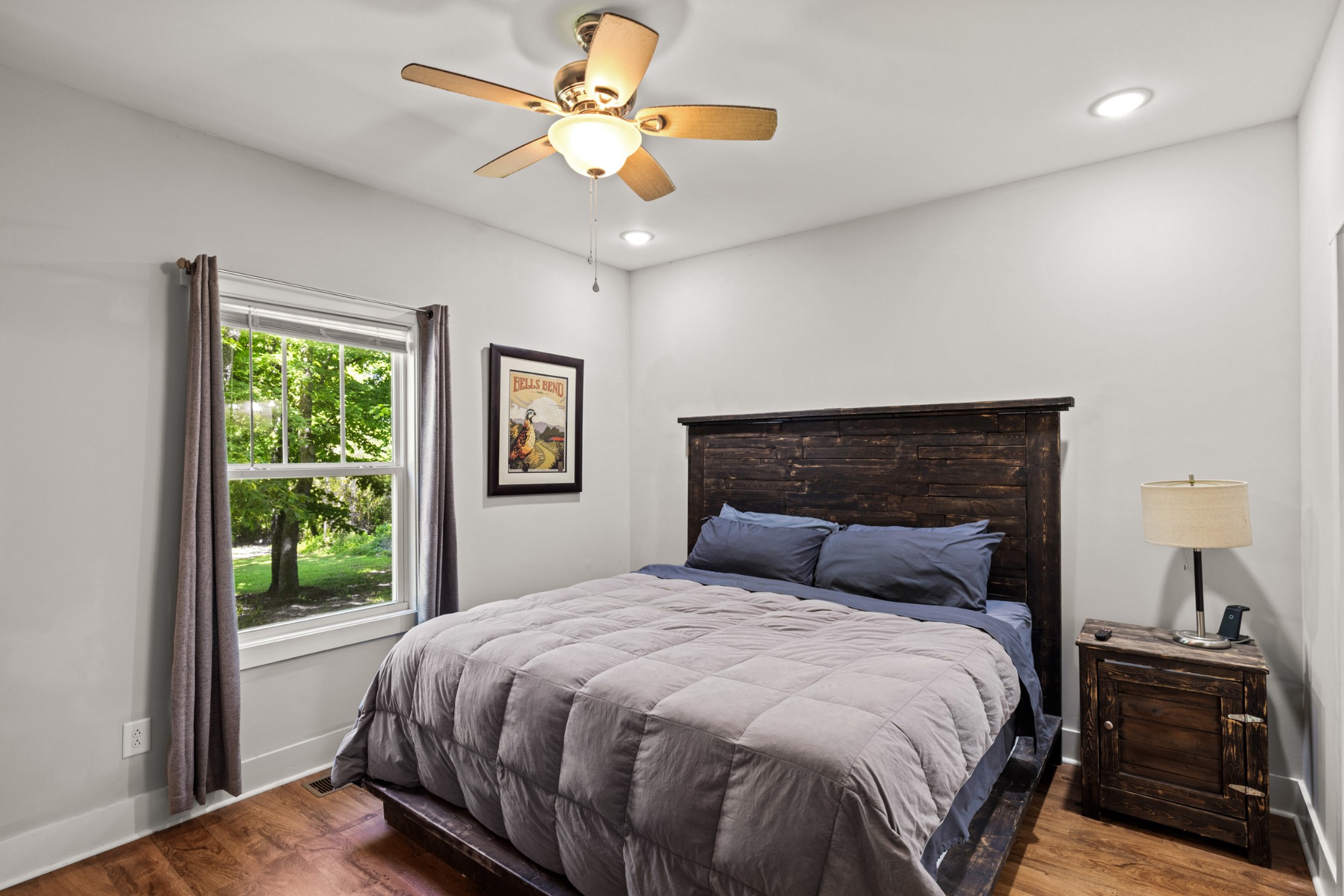 115 North Adams Street Adams, TN 37010 - Photo 23 of 44 a bedroom with a large bed and a window
