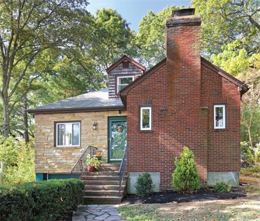 59 Leland Road Brookline, MA 02467 - Photo 1 of 10 a house view with a garden space