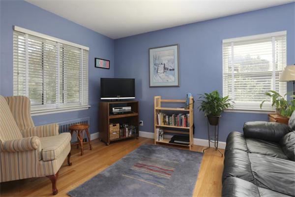 59 Leland Road Brookline, MA 02467 - Photo 7 of 10 a living room with furniture a window and a flat screen tv