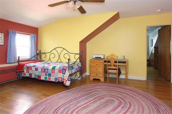 59 Leland Road Brookline, MA 02467 - Photo 8 of 10 a bedroom with a bed next to a window with outer view