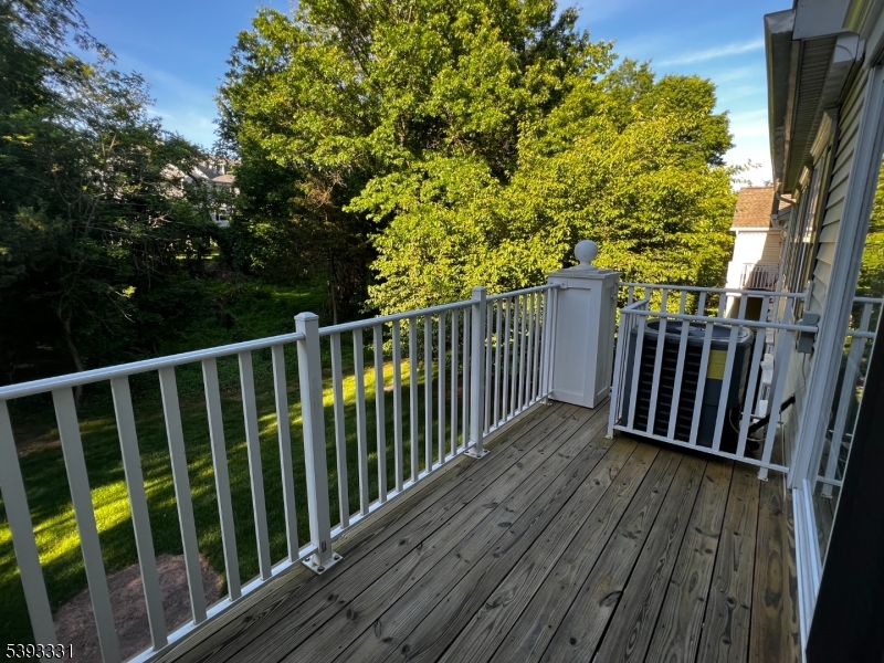 1007 Magnolia Lane Somerville, NJ 08876 - Photo 13 of 13 a view of deck with wooden floor and fence