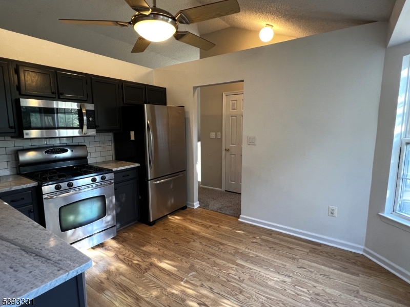 1007 Magnolia Lane Somerville, NJ 08876 - Photo 2 of 13 a kitchen with stainless steel appliances granite countertop a refrigerator a stove and a sink