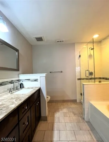 a bathroom with a sink a vanity and a mirror