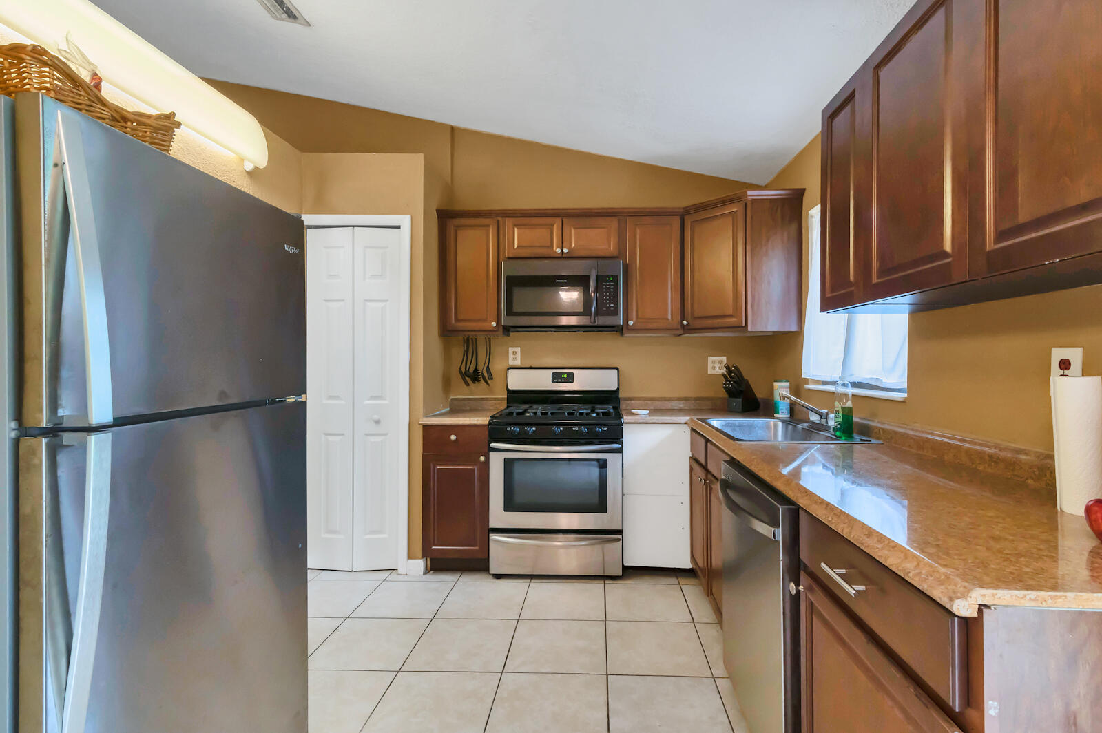 4091 Mandarin Boulevard Loxahatchee, FL 33470 - Photo 11 of 31 a kitchen with a refrigerator sink and stove top oven