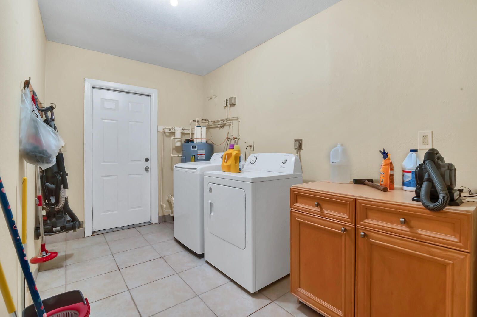 4091 Mandarin Boulevard Loxahatchee, FL 33470 - Photo 13 of 31 a view of storage and utility room with washer and dryer
