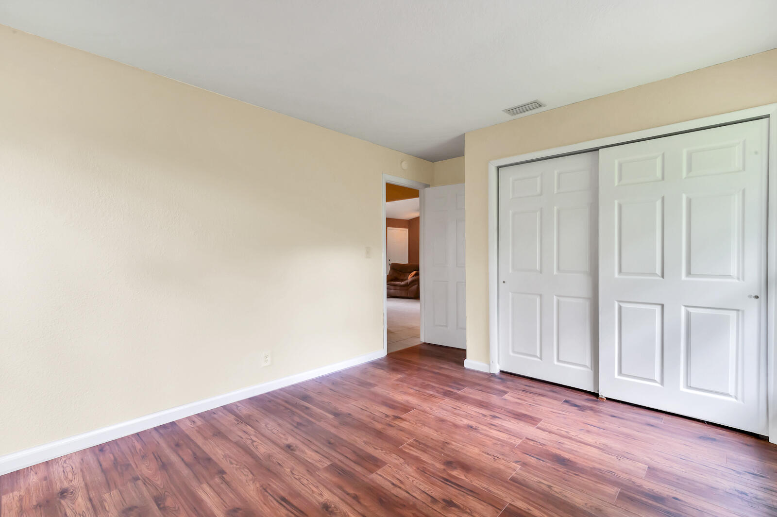 4091 Mandarin Boulevard Loxahatchee, FL 33470 - Photo 17 of 31 a view of an empty room with wooden floor