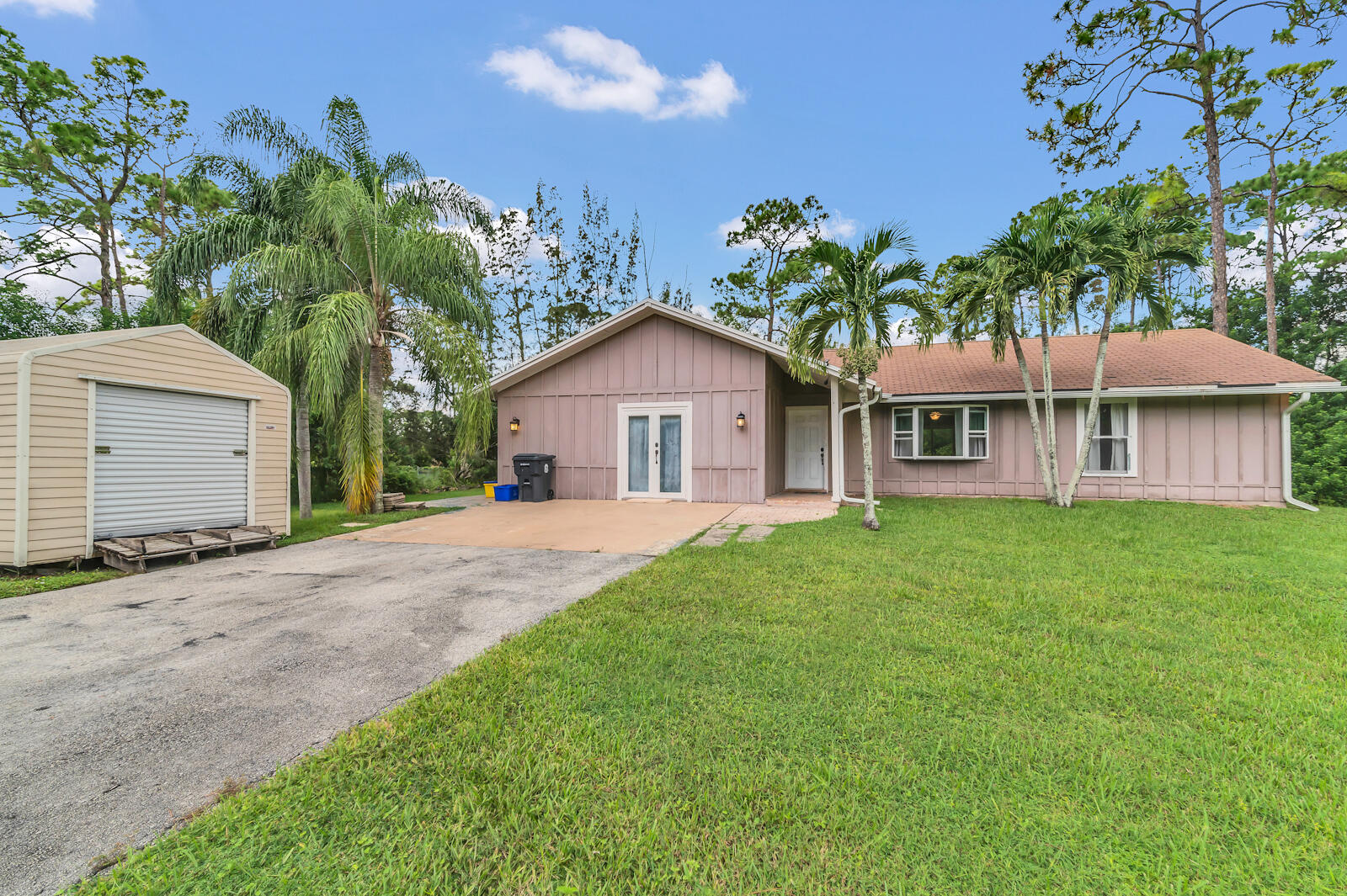 4091 Mandarin Boulevard Loxahatchee, FL 33470 - Photo 2 of 31 a view of a yard in front of house